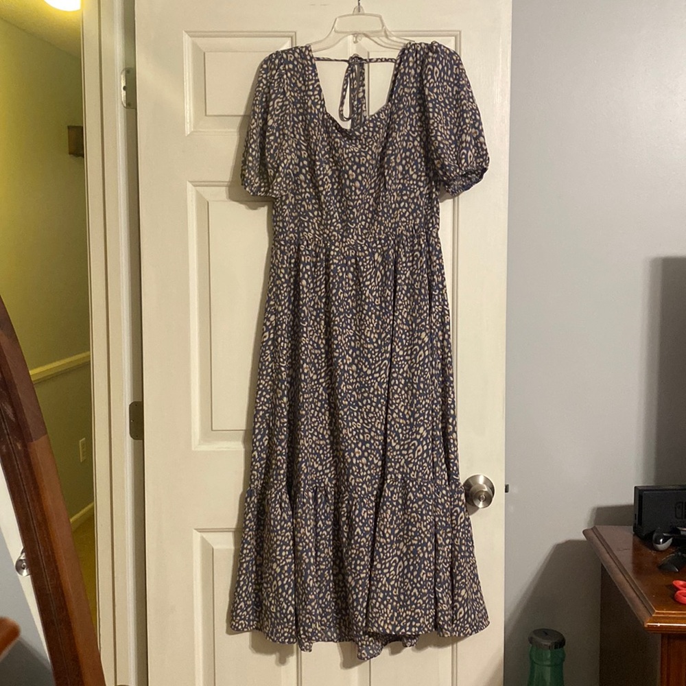 A navy base dress with beautiful designs. Perfect for weddings or church!